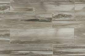 Sienna mille grey ash wood porcelain tile in 6x48, 8x48 and 12x48 planks. Kaska Porcelain Tile Fossilized Wood Series Grey 6 X24