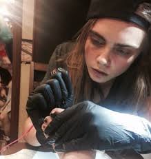 Tiny cara delevingne lion tiger on index finger animal tattoo design tattoo dimensions: A Complete Guide To Cara Delevingne S Tattoos And Their Meanings Grazia