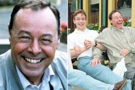 EastEnders legend Adam Woodyatt looks worlds away from Albert Square with  bushy beard and no glasses