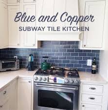 blue subway tile and copper kitchen