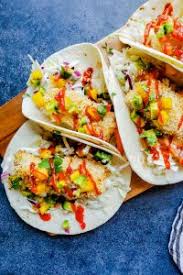 Separate panko, beaten eggs, and flour into individual shallow bowls. Baked Coconut Crusted Healthy Fish Tacos Erhardts Eat