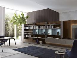 Me System Storage Wall With Integrated Lighting By Misuraemme Wall Storage Systems Furniture Design Living Room With Fireplace