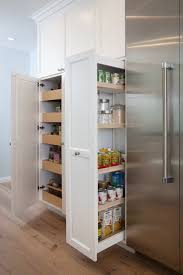 Kitchen Wall Fitted With White Shaker Cabinets Which Open To Reveal Slide Out Pantry Drawers And Pull Ou Kitchen Wall Storage Kitchen Wall Cabinets Pantry Wall