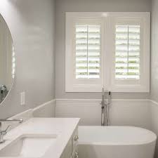 Bathroom shutters for window of detached house in south. Plantation Shutters Window Coverings Blinds Sunburst Shutters