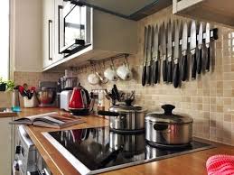 In an effort to add more light to the space, the ceiling is covered in a textured orange wallpaper. Smaller Simpler Kitchens Coming Soon