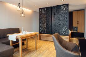 The present invention relates to partition wall lamps to be arranged in a partition wall (100) between two interior rooms (104, 105) or an outer. Room Divider Partition Wall Cellon From Bruag