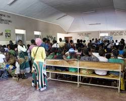 Image of crowded waiting room in a Malawian clinic