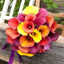 A simple bouquet of lilies with no additional flowers serves the purpose while sticking to the theme of the and you could probably do it yourself. Fabulous Flowers For Fall Weddings Colorful Wedding Flowers Fall Wedding Bouquets Bridal Bouquet Fall