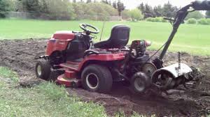 Attached wheels and drag stake make it easy to maneuver through rows without damaging plants. Tow Behind Tiller For Riding Lawn Mower Off 55