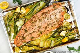 In a baking dish, combine potatoes, corn, 2 garlic cloves, 1 tablespoon of oil, and ½ tablespoon of the cajun spice mix. Oven Baked Seafood How To Cook Seafood In The Oven