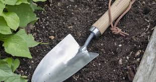 Wooden Hawkesbury Garden Hand Trowel In A Flowerbed Click To Purchase Garden Trading In 2020 Hand Trowel Garden Tools Trowel