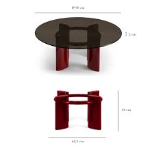 A glass coffee table makes for an elegant, subtle addition to the room, while a coffee table with storage is perfect for creating space for a striking centerpiece. Coffee Table With Red Lacquered Legs And Smoked Glass Top Carlotta The Socialite Family