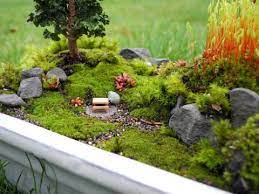 Remove the center from one of the colorful silk flowers and glue it on as a doorknob. Miniature Moss Gardening Miniature Garden Plants Miniature Zen Garden Miniature Garden