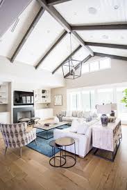 Cathedral ceilings can be a dramatic look. Transitional Living Room Boasts Vaulted Ceilings With Wood Beams Vaulted Ceiling Living Room Ceiling Beams Living Room Beams Living Room