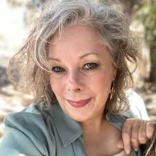 Bandera mayor Suzanne Schauman presents a recognition award to Deputy  Marshal, Willie Smith, for five years of dedicated service to the citizens  of Bandera.