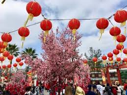 Chinese new year festival decorations pow or red packet, orange and gold ingots or golden lump on a red background. Celebrate Lunar New Year 2021 In Los Angeles