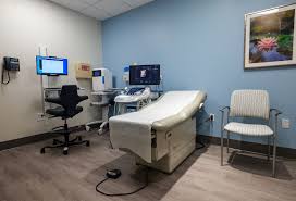 Exam room with ultrasound equipment for high-risk pregnancy monitoring