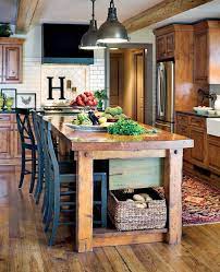 Check out these small house pictures and plans that maximize both function and style! Jill Tran Rustic Home Kitchen Island Decor Kitchen Island Design Farmhouse Kitchen Tables