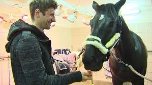 Thomas muller loves to horse around with his nag dave credit: Thomas Muller World Cup Winner To Director Of Carrots Cnn