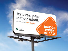 We specialize in asphalt sealing and repair solutions. City Of Saskatoon Pain In The Asphalt Road Construction Billboard Wide Shot Humanly Branding Marketing