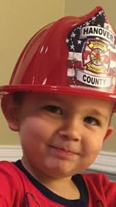 Firefighters shave heads to support colleague's son with cancer