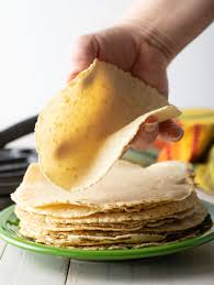 Using tongs, carefully flip the tortilla to fry the other side until golden (continue holding the free edge to maintain the shape). How To Make Corn Tortillas Soft Flexible A Spicy Perspective