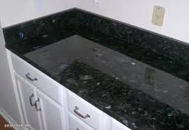 Crisp white paint and gray glass tile. Ukrain Galactic Blue Volga Blue Granite Countertops With Cabinets
