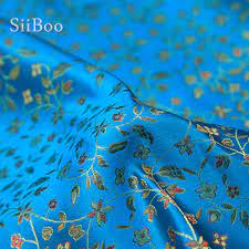 Indigo blue shades floral and leaves design jacquard fabric excellent to cover chairs and sofas, durable for curtains and drapery swavelle cool cat denim blue jacquard fabric by the yard. Pastoral Style Elegant Orange Blue Floral Jacquard Brocade Fabric For Dress Coat Cloth Fabric For Sewing Telas Tecidos Sp4401 Jacquard Brocade Fabric Brocade Fabricfabric For Dress Aliexpress