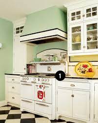 Dura supreme cabinetry shown in the dempsey door style in a custom heritage paint finish featuring the gale force painted finish. 1920s Kitchen Done Right Old House Journal Magazine