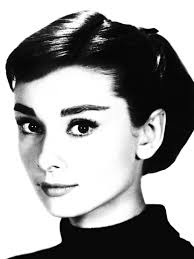 The shot with Audrey Hepburn was taken during the filming of Funny Face,  which is very, very loosely based