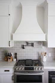 Curved Kitchen Hood White Kitchen With Curved Kitchen Hood And Grey Subway Tile Curved Kitchen Hood Curv Curved Kitchen Interior Design Kitchen Kitchen Design