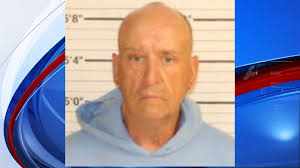 Caregiver charged after 83-year-old found buried in her own garden