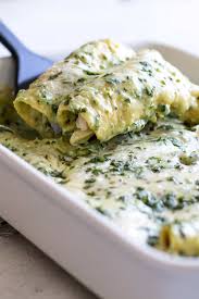 In a bowl, toss the remaining roasted vegetables, the beans, rice, cumin, and half the cheese for the filling. Creamy Poblano Chicken Enchiladas Girl Gone Gourmet
