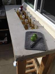 This diy bar is made from concrete blocks, so it won't put a huge dent in your wallet and it will stand up to strong winds and dreary weather. Pin By Erin White On Maybe Fence Me In Outdoor Kitchen Cabinets Outdoor Kitchen Countertops Outdoor Kitchen