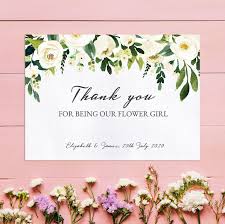 Five dahlia heads facing forwards laid in a neat row with the word 'thank you' in turquoise blue emerging from the top in a wide thank you teacher red flower. Cream Flowers Thank You For Being Our Flower Girl Card Only 3 00