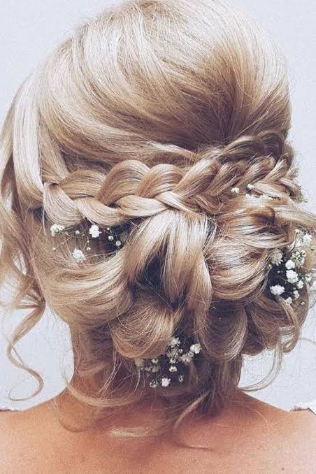 Rustic wedding hairstyles curly low bun with braids and baby breath hairbyhannahtaylor | Wedding forward hair, Prom hair updo, Bridal hairstyles