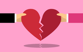 Broken heart with hands pulling apart