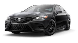 Black mirror caps, door handles, window trim and badging. 2020 Toyota Camry Models L Vs Le Vs Se Vs Trd Vs Xle Vs Xse