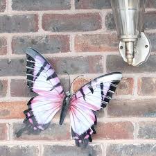 Removable wall decal, graphics and stickers are some examples of modern wall art you can apply to. Primus Large Butterfly Metal Garden Ornament Pink Black Oasis Gardening Ltd