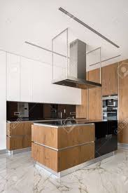 Maybe you would like to learn more about one of these? Luxury Design Kitchen With Marble Floor Tiles And Wooden Furniture Stock Photo Picture And Royalty Free Image Image 135445583