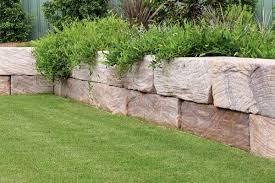 Beveled face creates straight or curved garden and low retaining walls, tree rings and planters curved bottom aids fast install Retaining Wall Construction Blue Mountains The Landscaped Garden