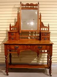 This beautiful vintage dressing table was created as a commission order and is part of a bedroom set consisting of this, together with bedsides and a chest elegant victorian pine desk or dressing table, standing on finely turned les with a small galleried back. Antique Tasmanian Huon Pine Dressing Table The Merchant Of Welby