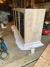 I'm finally installing my cabinets and it's going well so far. Diy Bar Cabinet Plans With Mini Fridge Sliding Doors Sarah Bella
