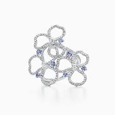 This intricate diamond and tanzanite ring personifies urban sophistication. Tiffany Paper Flowers Rings With Tanzanites Tiffany Co