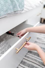 Ikea Hack Brimnes Bed Add Brass Hardware For A Chic Update Brimnes Bed Ikea Bed Hack Ikea Bed