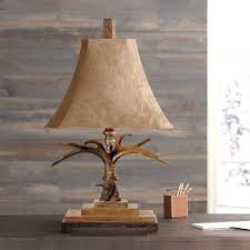 The stag horn lamp from uttermost brings a unique look to the office, with a crackled woodstone base and cast aluminum accents complementing its most distinct feature. Uttermost Faux Antler Suede Table Lamp 52684 Lamps Plus