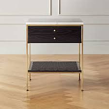 A modern nightstand with standout details, this side table is built from acacia wood with a minimalist build, featuring an open shelf at base and a top drawer with a woven jute panel and bar pull. Modern Nightstands And Bedside Tables Cb2