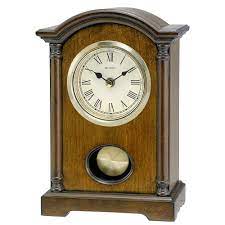 This desk clock is shaped like an ellipse with the bottom cut off to place the feet. Bulova Dalton Chiming Pendulum Table Clock Walnut Finish Gold Tone Accents Buy Online In El Salvador At Elsalvador Desertcart Com Productid 10341406