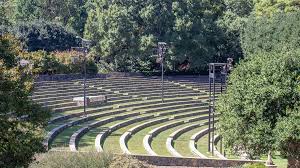 Varied grasses like miscanthus 'purpurascens' and panicum 'bad hair day' sit. The Raleigh Rose Garden Raleigh Little Theatre The Cultural Landscape Foundation