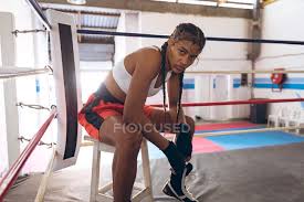 List includes the most notable boxers from the united states, along with photos when available. African American Female Boxer Looking At Camera While Relaxing In Boxing Ring At Fitness Center Strong Female Fighter In Boxing Gym Training Hard Sitting Athlete Stock Photo 303111446